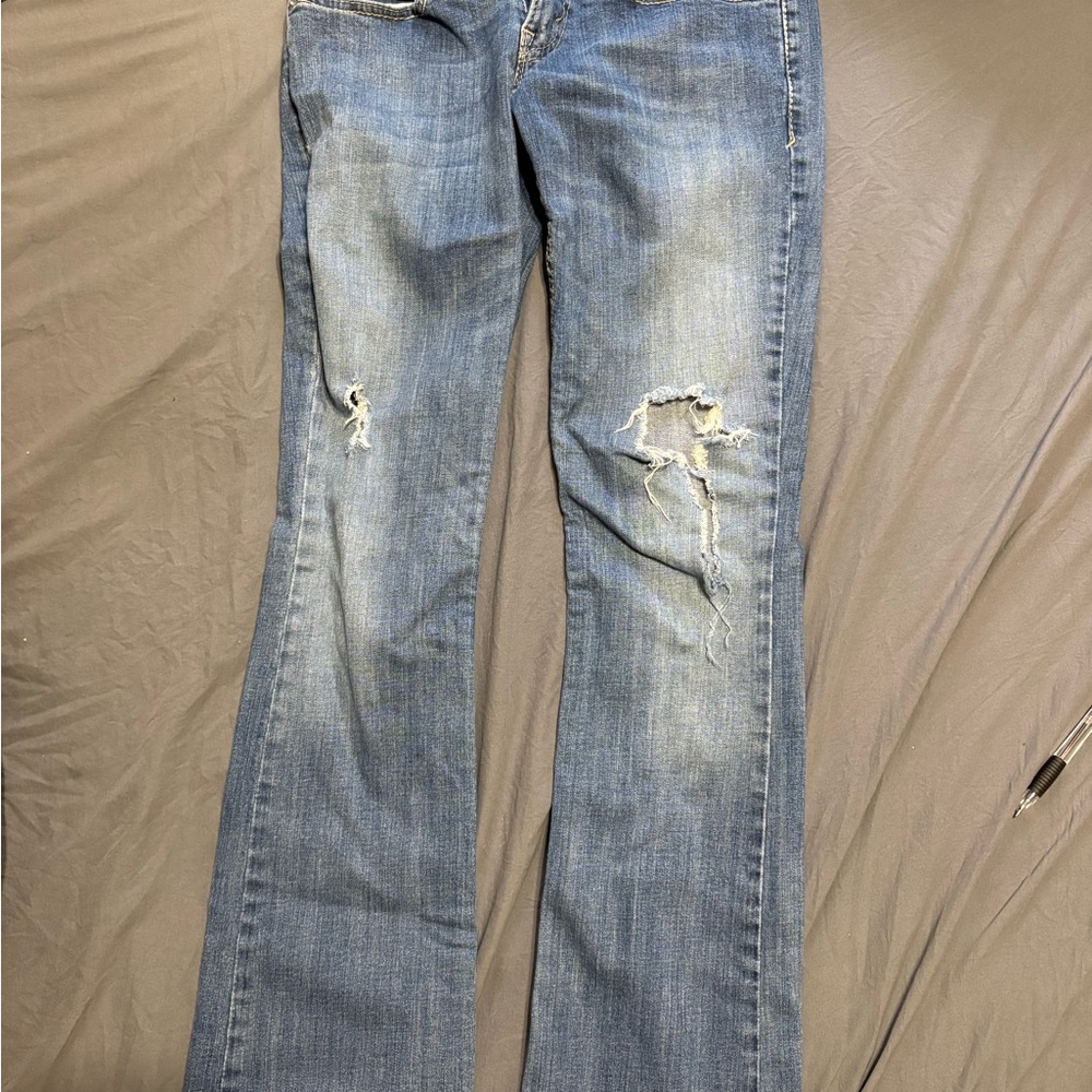 10.Levi's Light Blue Distressed Boot Cut Jeans